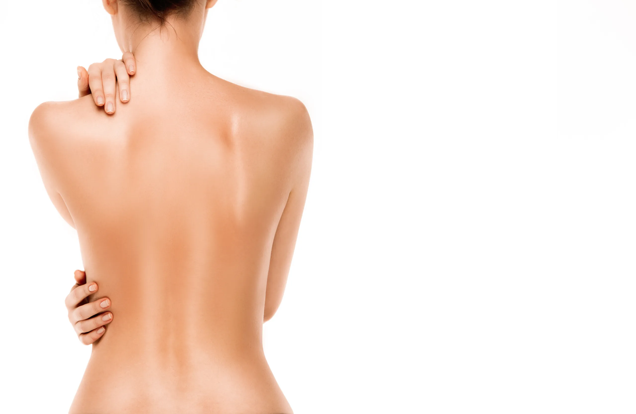Naked back of a woman isolated on white background