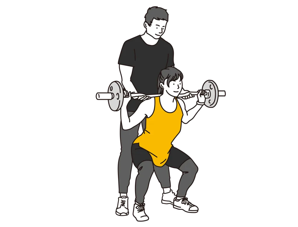 女性が男性のトレーナーにトレーニングを受けている