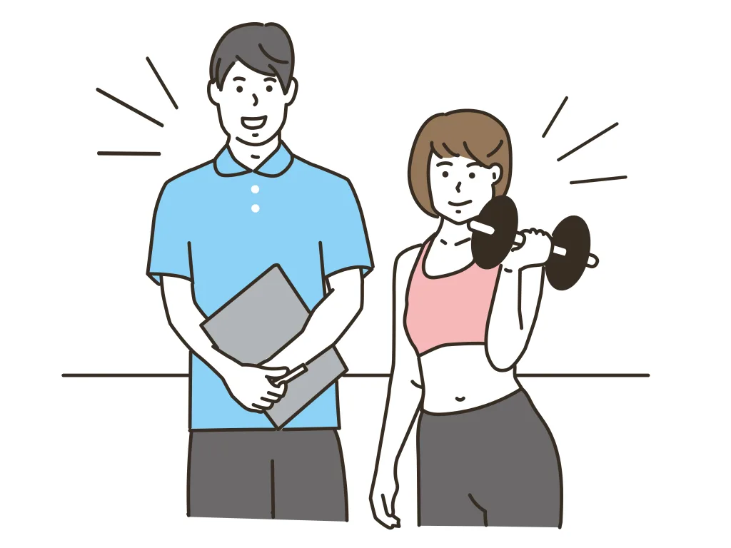 トレーナーとダンベルを持つ女性